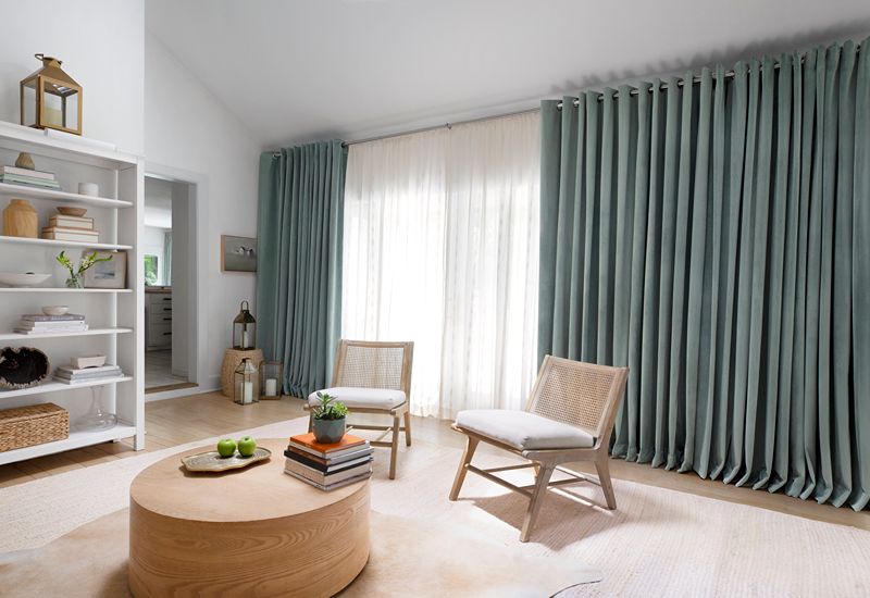 How do you layer sheer and blackout curtains on a sunny window